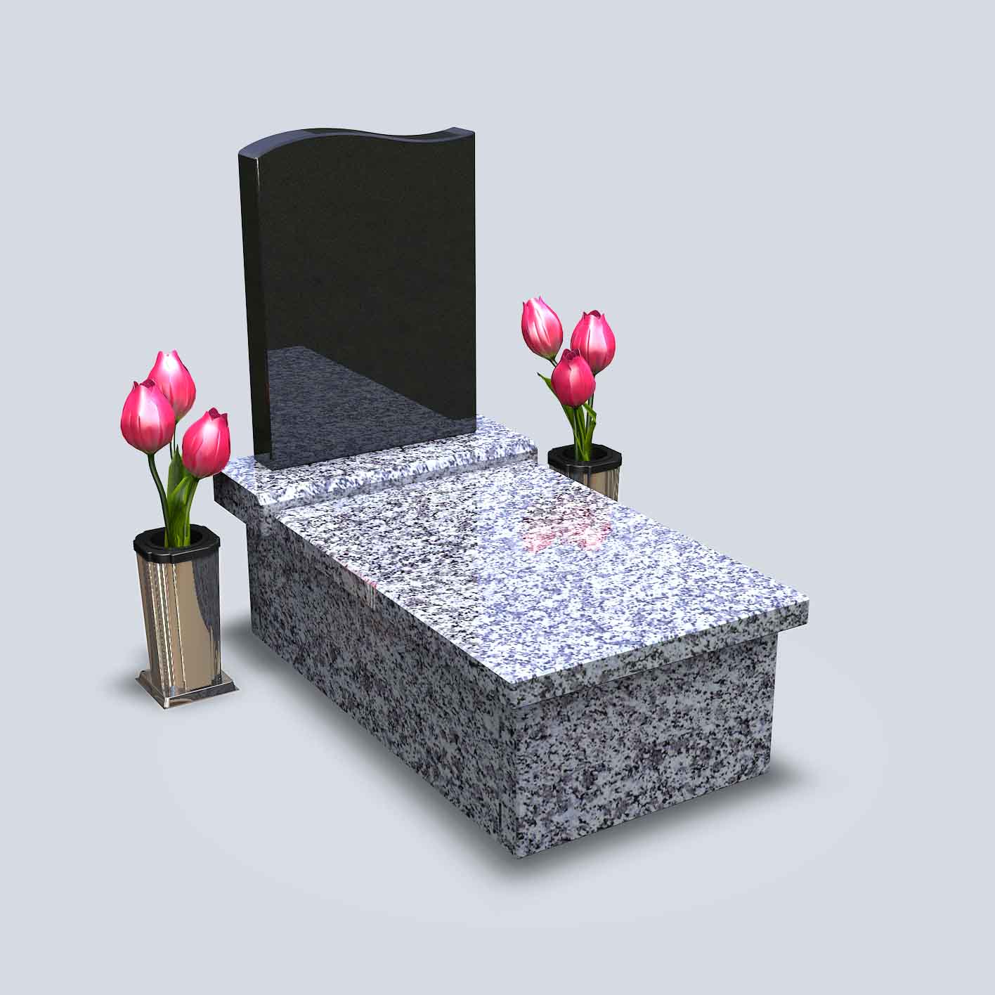 Urnový hrob z bledej žuly s čiernym pomníkom, vázou a červenými tulipánmi