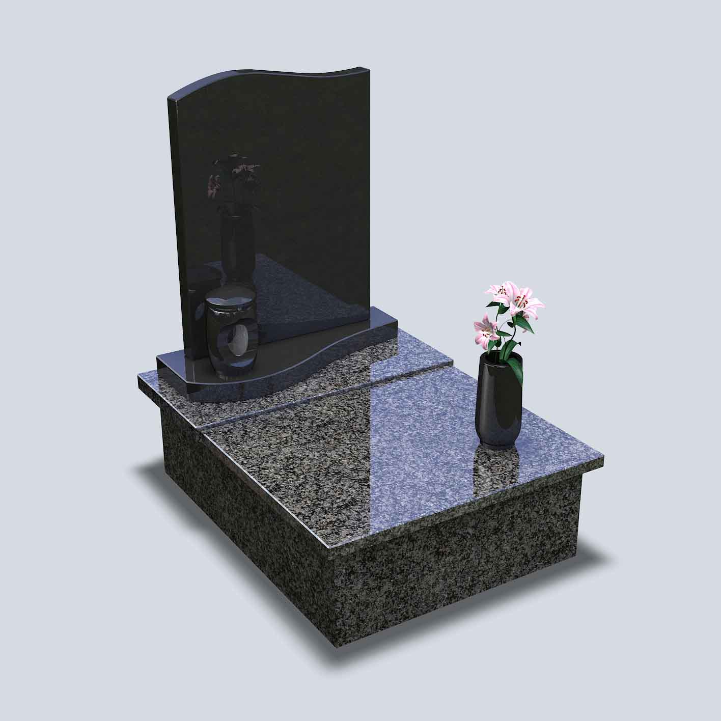 Urnový hrob z tmavej žuly s kamennými doplnkami vázou a svietnikom